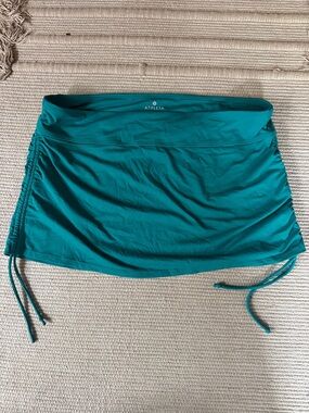 Athleta swim skirt teal aqua sea turquoise scrunch ties on sides women’s L NEW